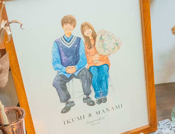この度は素敵な絵をありがとうございました。
「夫婦で似顔絵を描いてもらいたいね」と話しており、フジエさんの絵が私たちの求める絵そのものでした。
絵を注文する時からどんな構図にしようか、どんな服にしようかとわくわくを膨らませてくれました。
そして届いた絵は結婚式のウェルカムスペースに飾りたい、結婚式後はおしゃれに家に飾りたい全てを叶えてくれる本当に素敵な絵でした！
ありがとうございました！

ウェルカムスペースが本当に素敵な空間になりましたので、ぜひ写真を見ていただきたくお送りいたします。

フジエさんにお願いして本当によかったです！ありがとうございました。

これからもたくさんの人に笑顔がとどきますように。
また機会がありましたらよろしくお願いします。