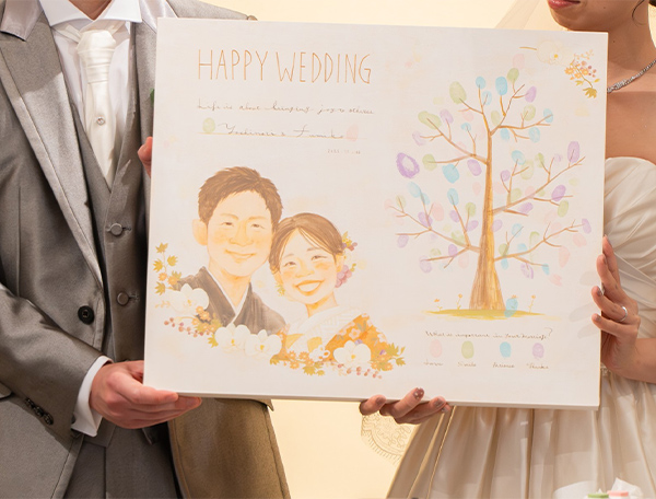 １１月に無事挙式が終わり、似顔絵は両親ともに大変喜んでいました。
また、ゲストの方々もウエディングツリーに楽しく指でスタンプを押してくださったようです。
本当にありがとうございました。
