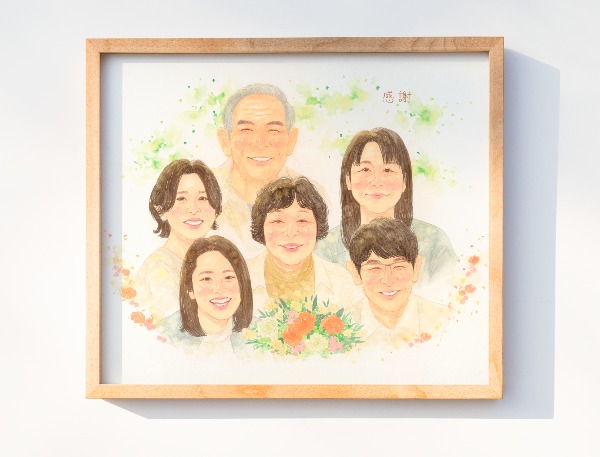 似顔絵無事に届き、すぐに拝見させていただきました。
素敵な作品ですぐに母にも写真を送りました。
口元や目元などそれぞれの特徴がしっかり捉えてられていて、なかでも祖父の写真が少ないなか、
おじいちゃんそのまんまだねって母と話してました。
祖母の笑った表情が本当にそっくりでびっくりしました。
祖母の大好きなお花も入れていただき凄く嬉しいかったです。

やっと昨日祖母に渡すことができ、凄く喜んでくれました。
最近祖母に新たな病気が見つかり、家族みんな落ち込んでしまっていたのですが、
似顔絵を見て笑顔な祖母を見ることができ、本当にお願いしてよかったなと改めて思いました。
似顔絵を見ていると気持ちが温かくなり、家族みんながいるからこんなに幸せなんだなと感じました。


今回たくさん要望させていただき、メールや写真など何度もご確認していただきありがとうございました。
とても良い作品にしていただきとても嬉しいです。
結婚式に引き続き、今回は祖母の米寿祝いでWORLD1で似顔絵をお願いして本当に良かったです。
また機会がありましたら宜しくお願いします！

今回は本当にありがとうございました。